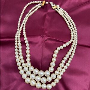 Three strand faux pearl necklace